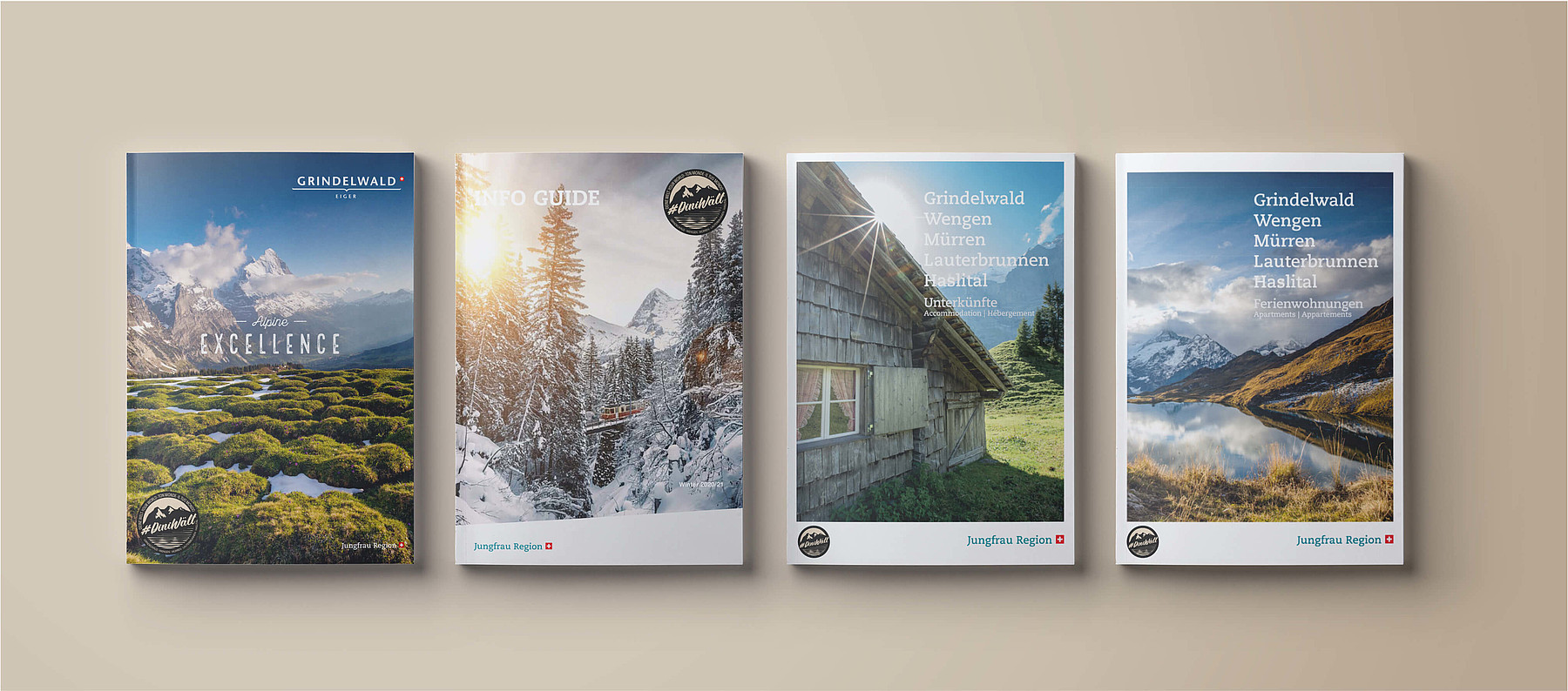 Vier Broschüren der Jungfrau-Region: «Grindelwald: Alpine Excellence», «Info Guide», «Unterkünfte» und «Ferienwohnungen»